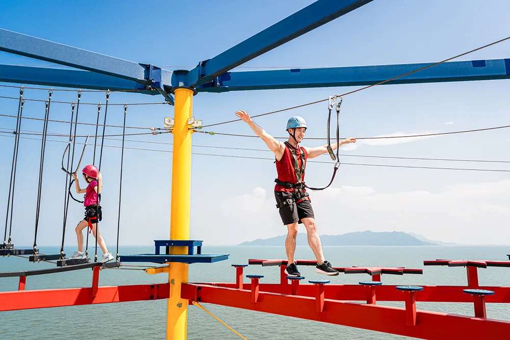 Zipline and ropes course over the sea on Genting Dream