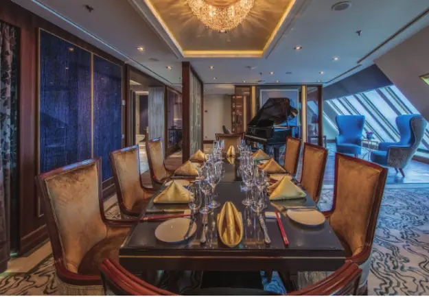 Luxurious private dining room inside The Palace Suite aboard Genting Dream Cruise