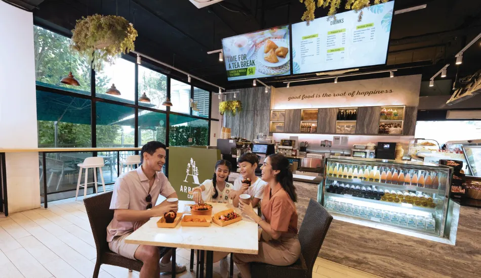 Family enjoying snacks at a cafe inside Universal Studios Singapore