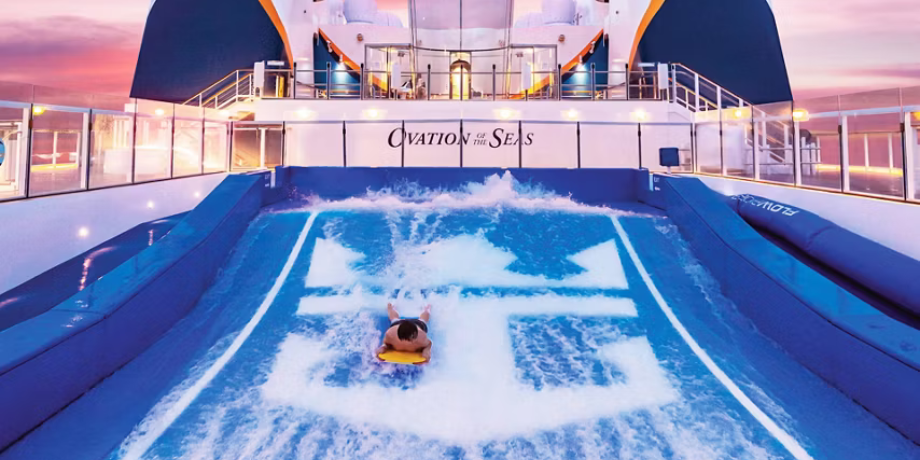 Cruise guest bodyboarding on the FlowRider surf simulator on Ovation of the Seas Cruise guest bodyboarding on the FlowRider surf simulator on Ovation of the Seas