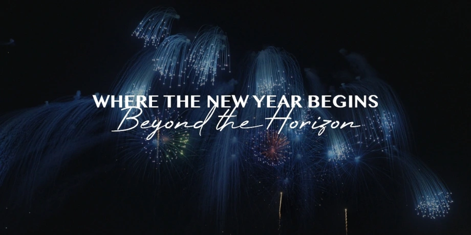 Blue fireworks at sea on Genting Dream with the text Where the New Year Begins — Beyond the Horizon.