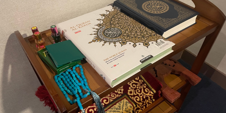 Quran, prayer beads, and Islamic books available in the prayer room on Genting Dream Cruise